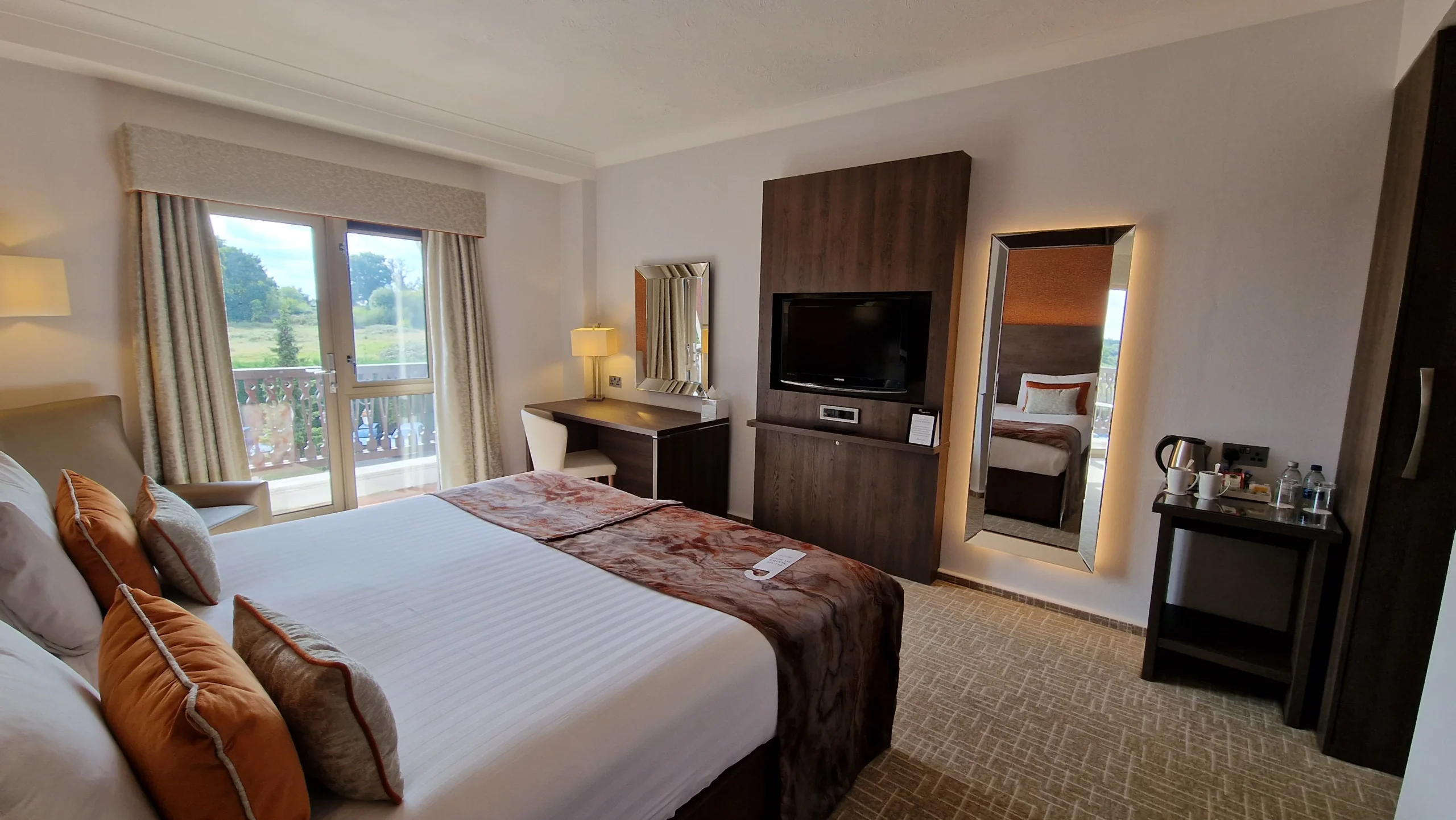 Woman relaxing on a hotel bed during a restful escape